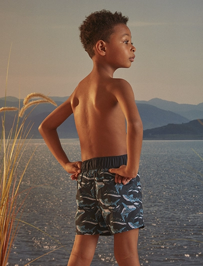 Navy blue swim shorts with shark print